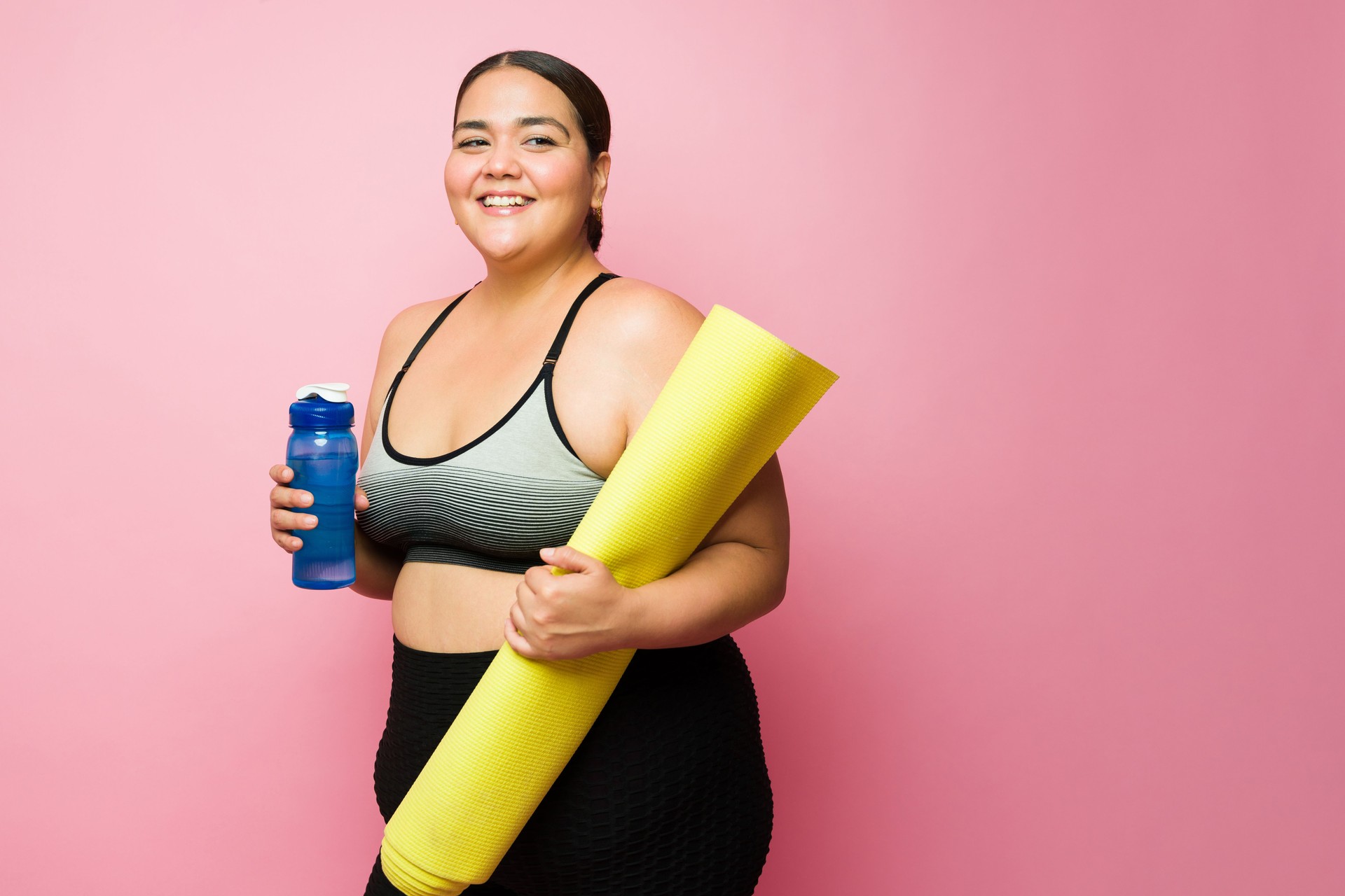 Happy fat woman finishing happy and losing weight with a cardio workout